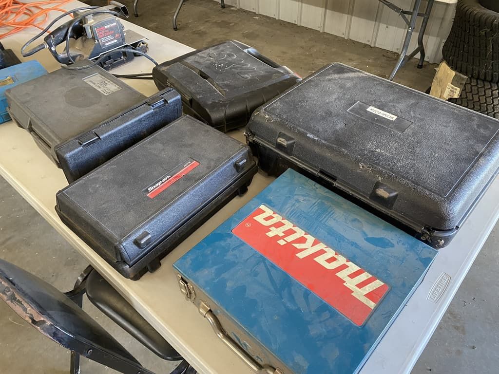 A table with a bunch of makita tools on it