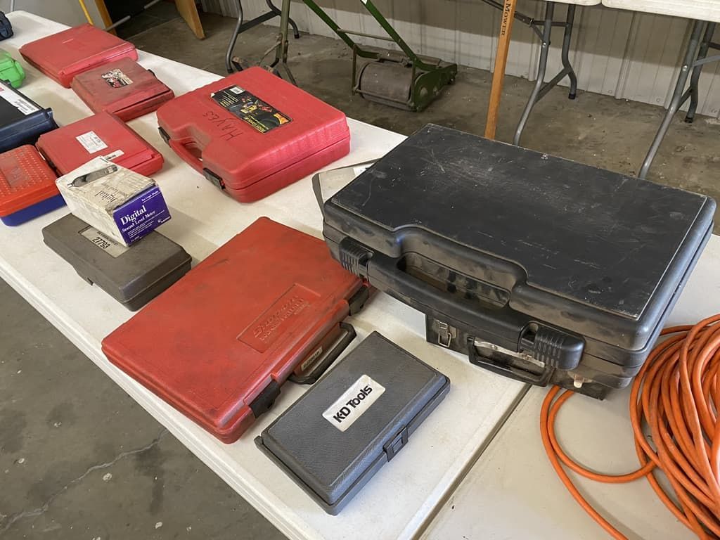 A table with a bunch of cases on it