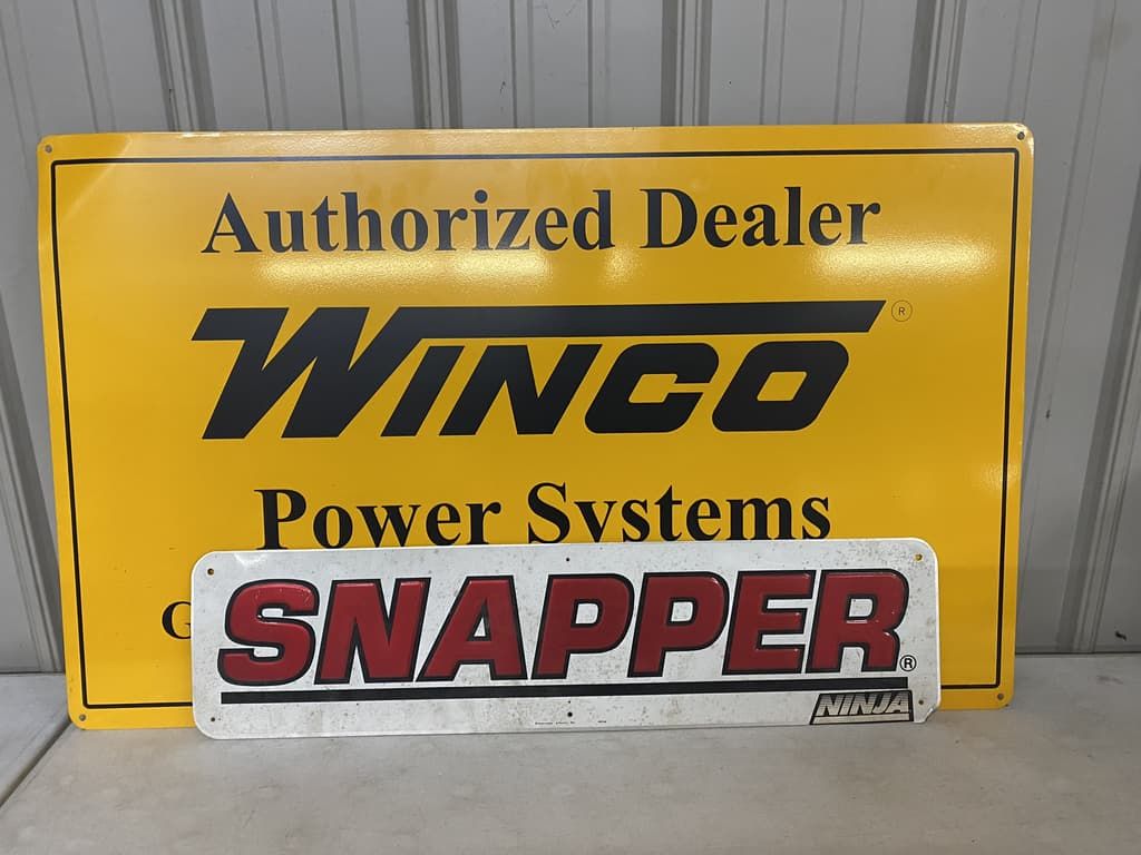 A yellow sign that says authorized dealer on it