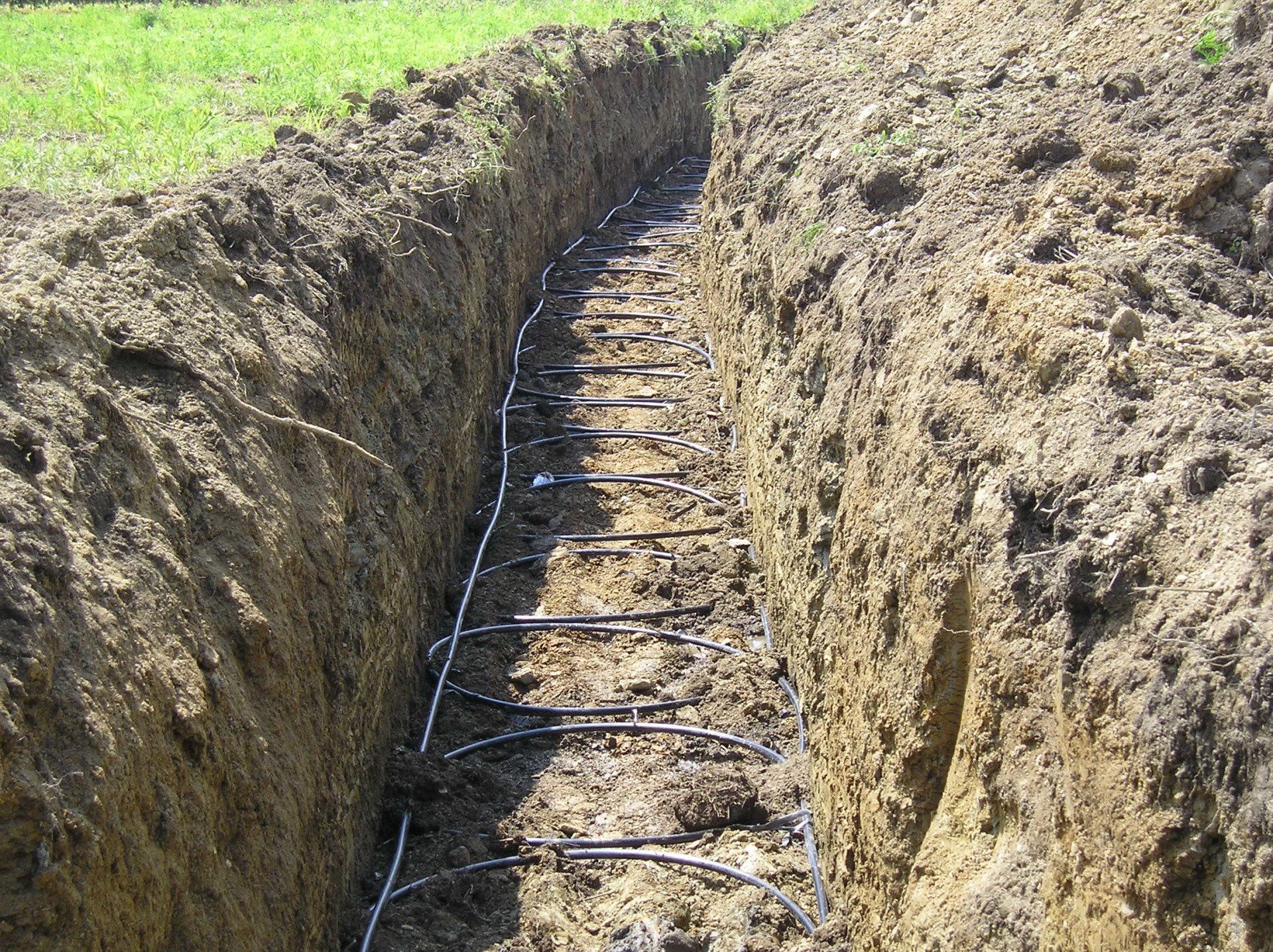 View of ground trench with wire laid on the base
