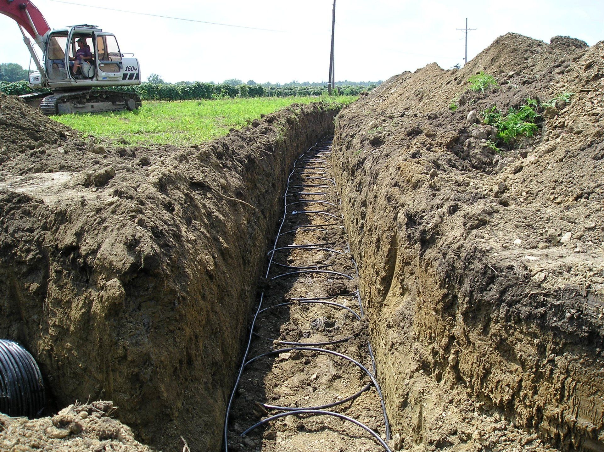 View of ground trench with wire laid on the base