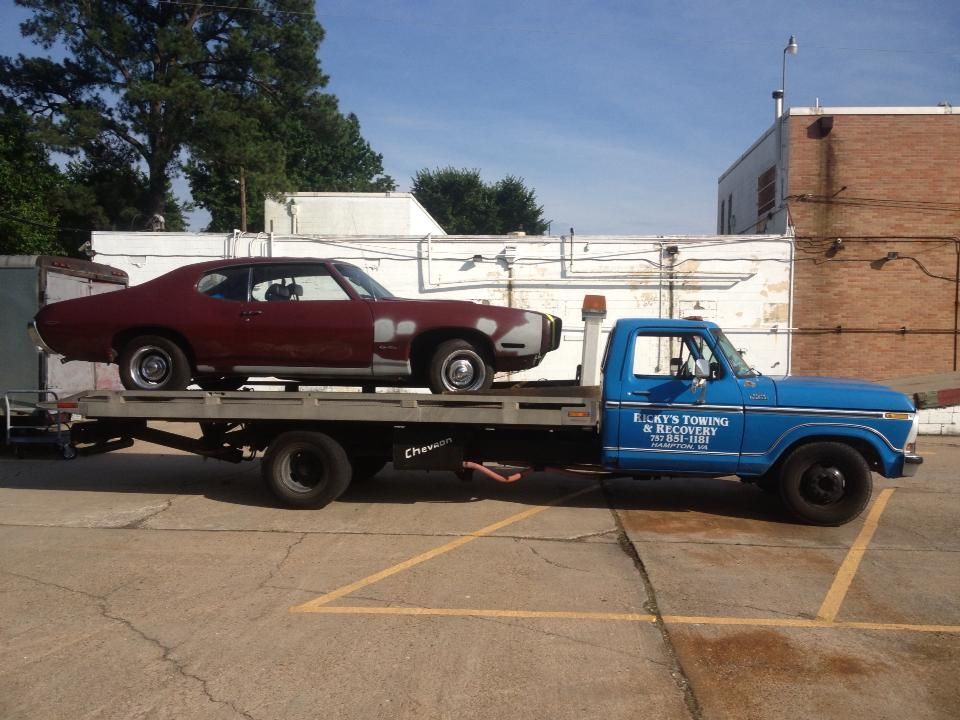 A payless shoesource store with a blue awning