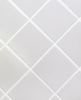 Picture of grey tiles with white grout.