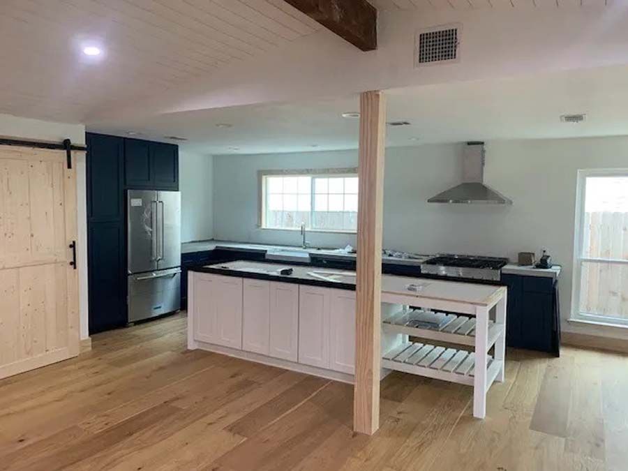 A kitchen with a large island in the middle of the room.