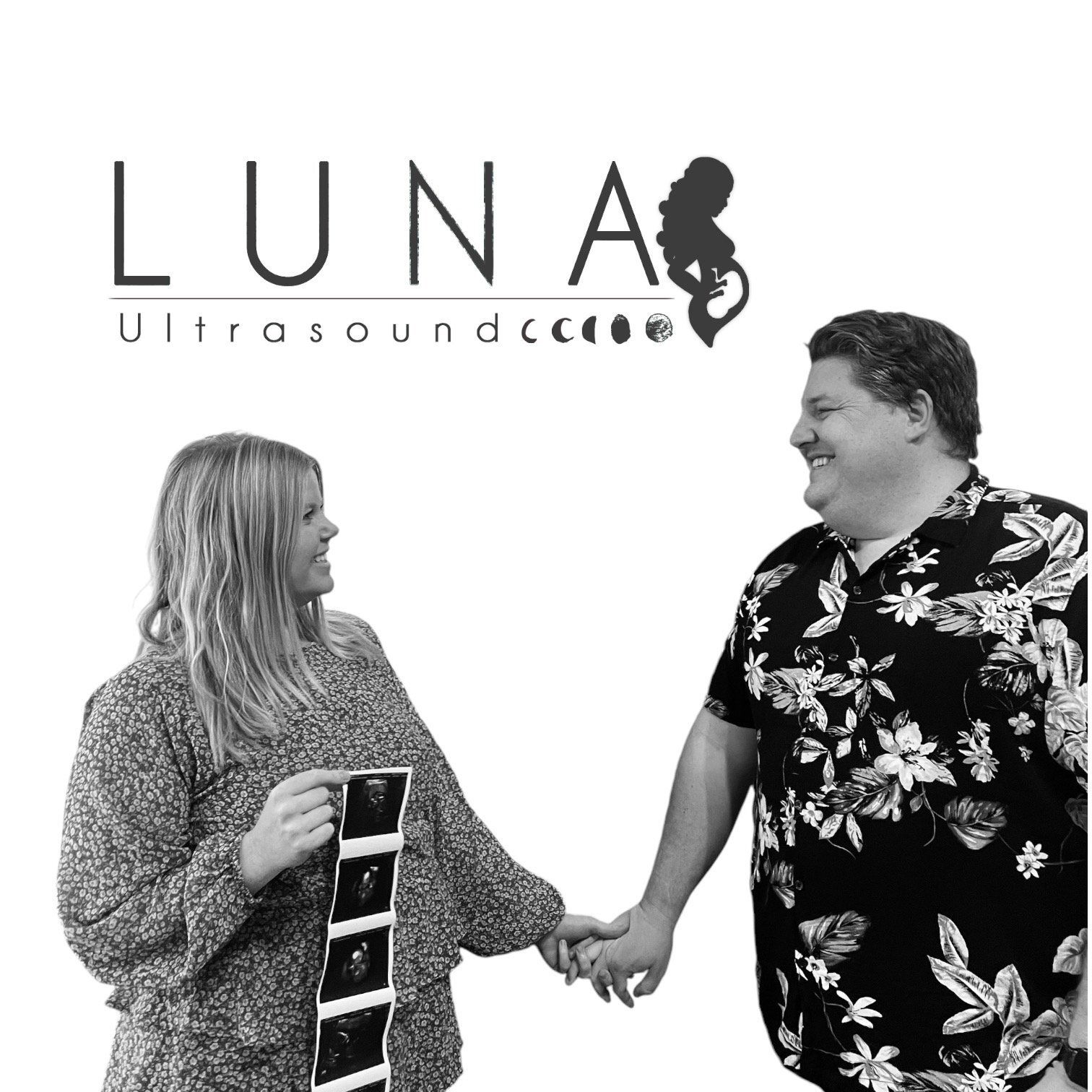 A man and a woman are holding hands in front of a luna ultrasound logo