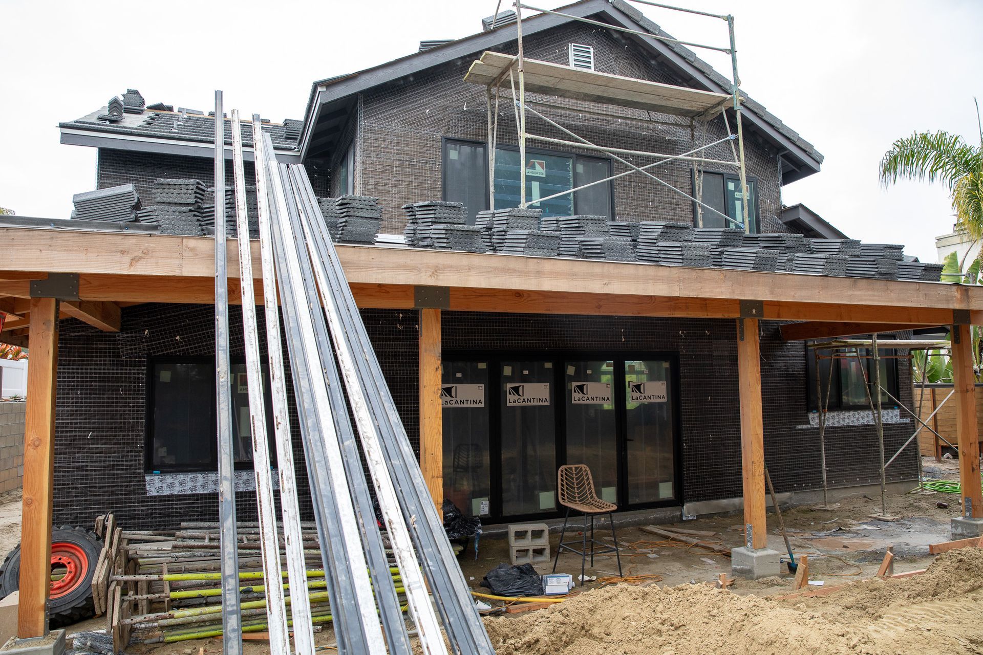 A house is being built with a lot of scaffolding around it.