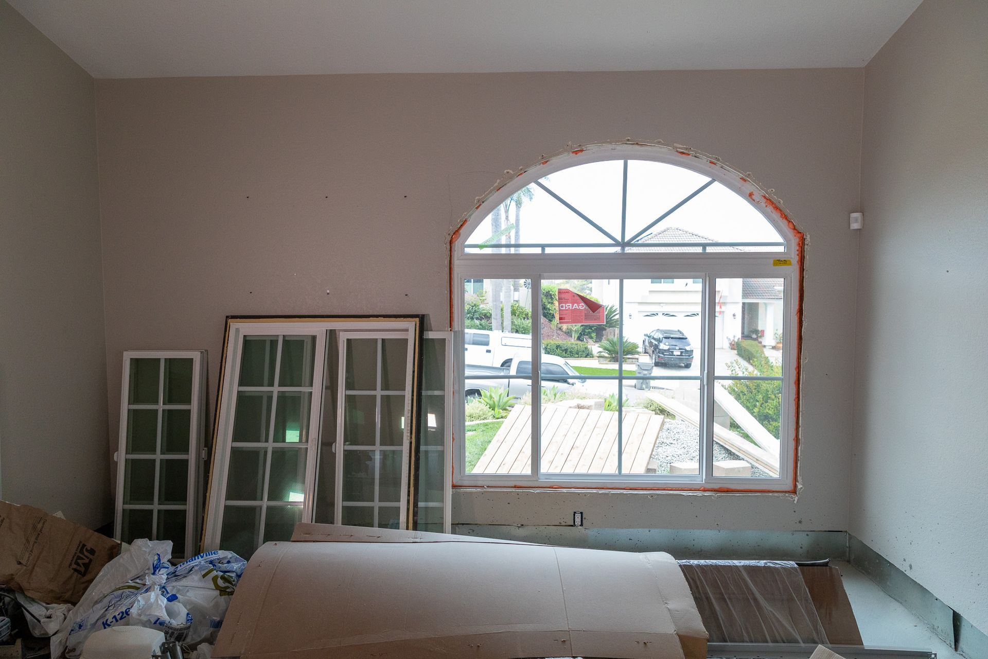 A room with a large window in the middle of it