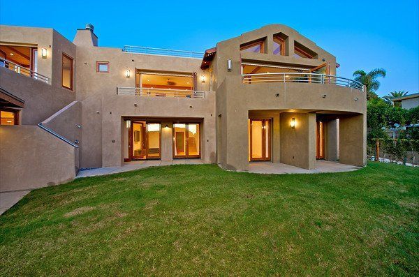 A large house with a large lawn in front of it in San Diego, Southern California.