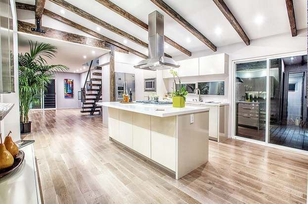 There is a large island in the middle of the kitchen.