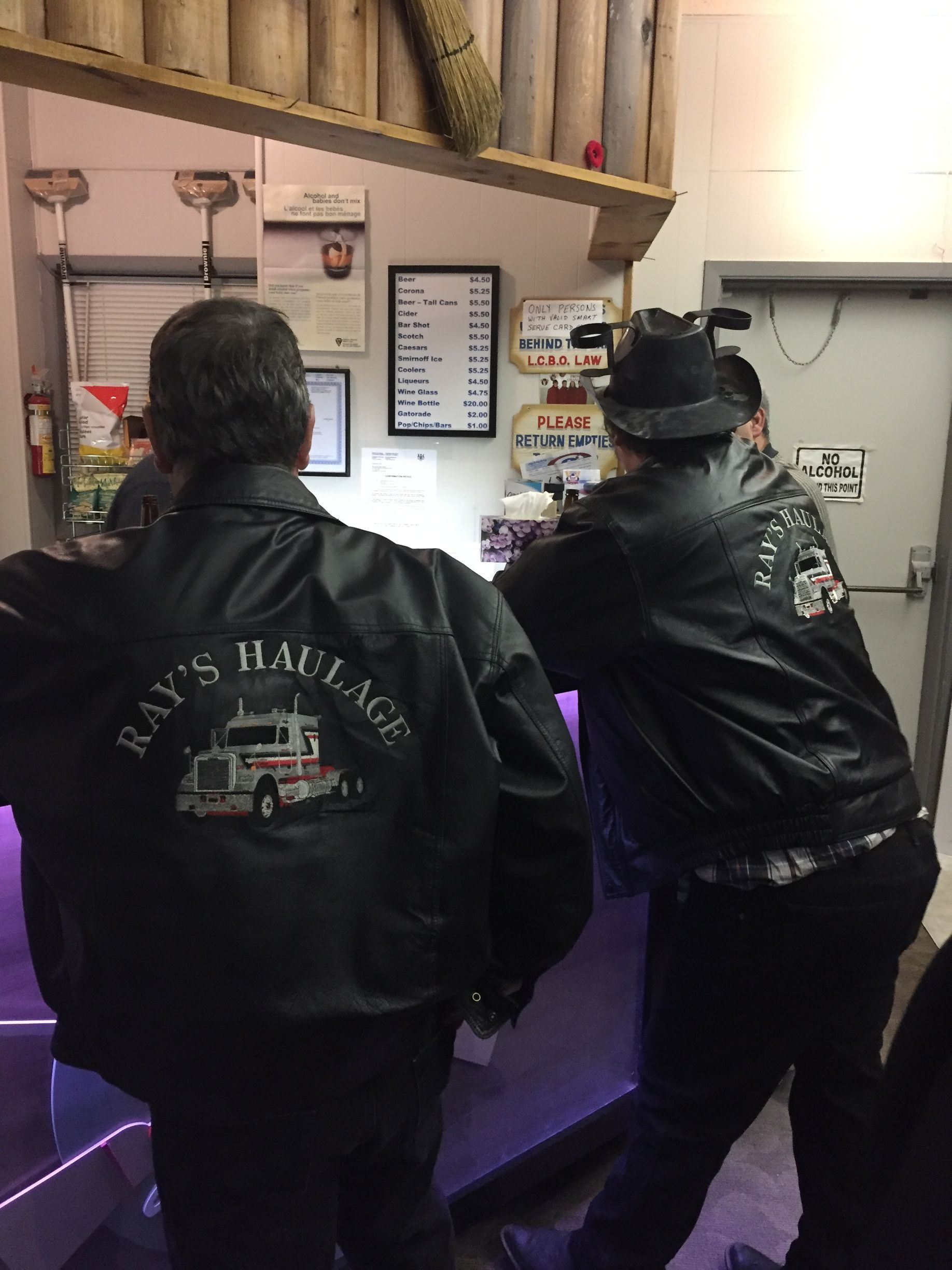 An excavator is loading dirt into a dump truck