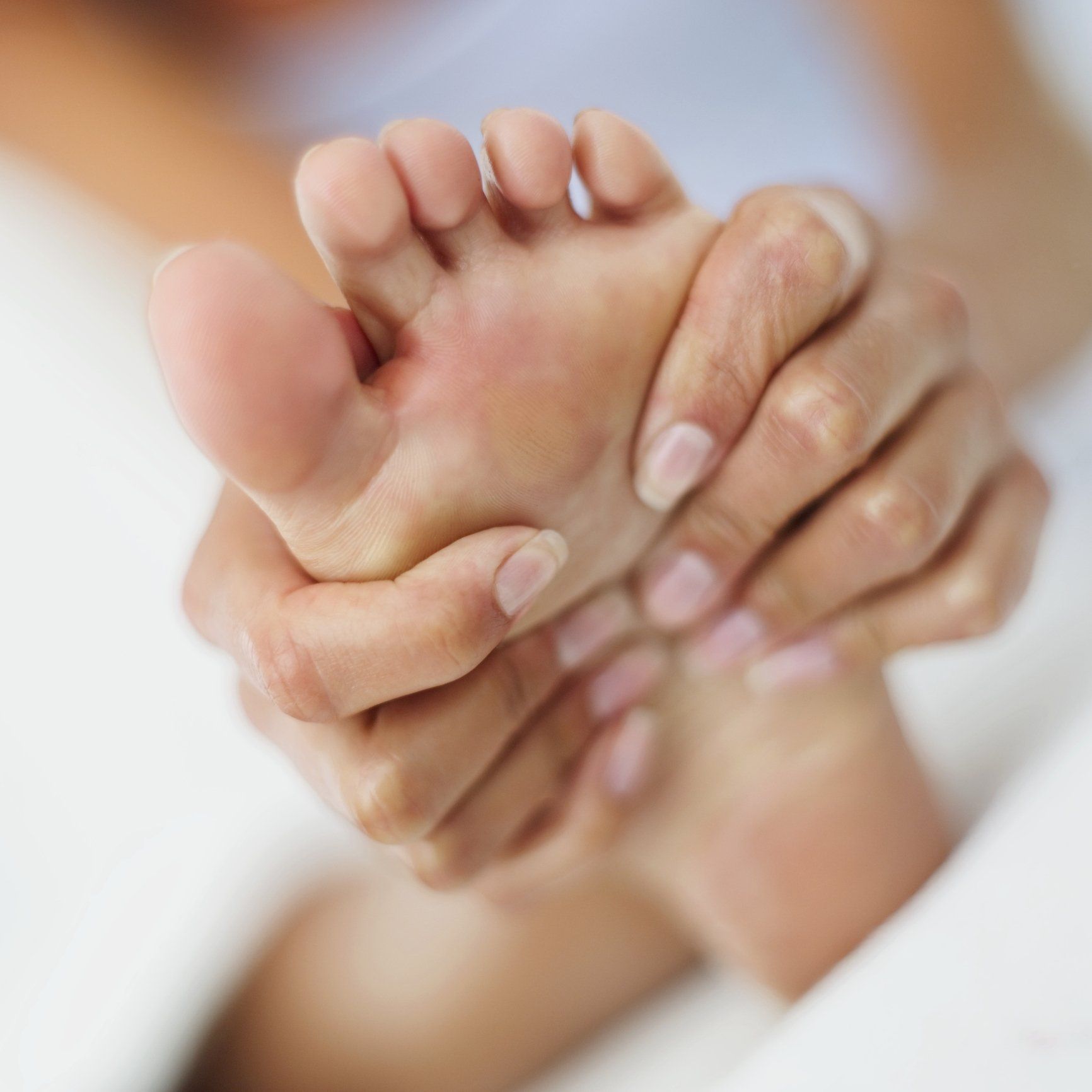 Specialists — Woman Massaging Her Foot in Lancaster & Mechanicsburg, PA