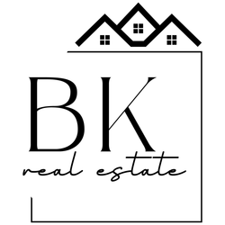 A black and white silhouette of a city skyline in a circle.
