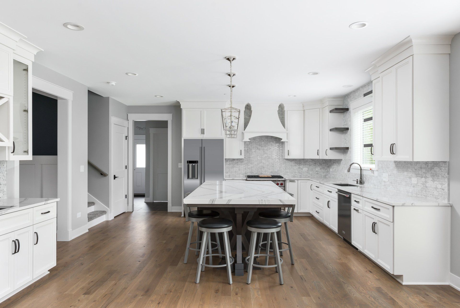 There is a large island in the middle of the kitchen.
