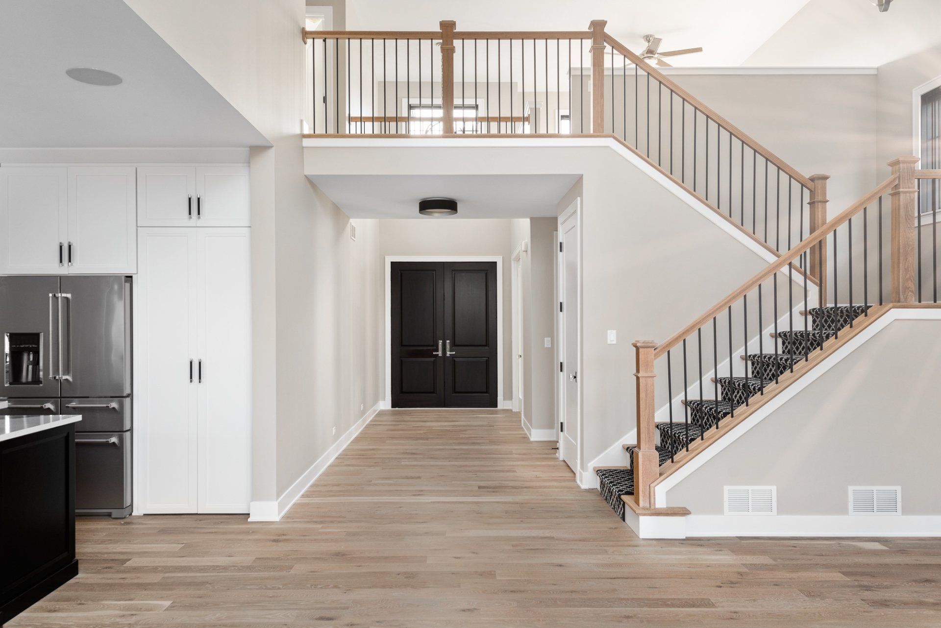 There is a staircase leading up to the second floor of a house.
