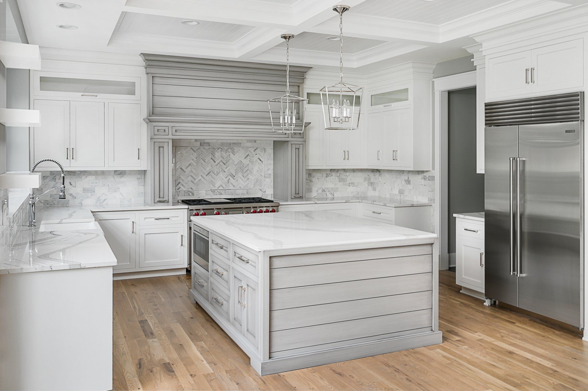 There is a large island in the middle of the kitchen.