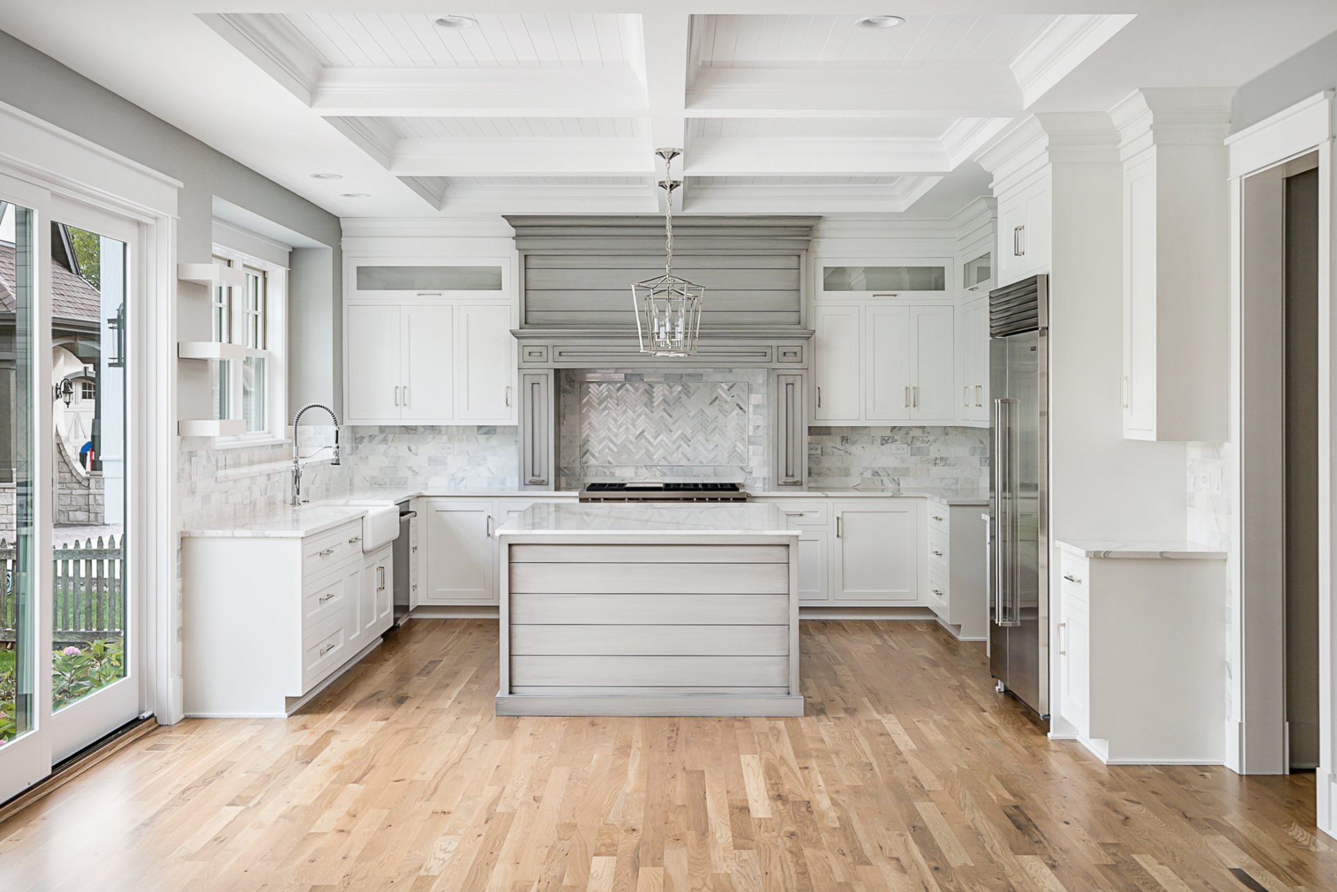 There is a large island in the middle of the kitchen.