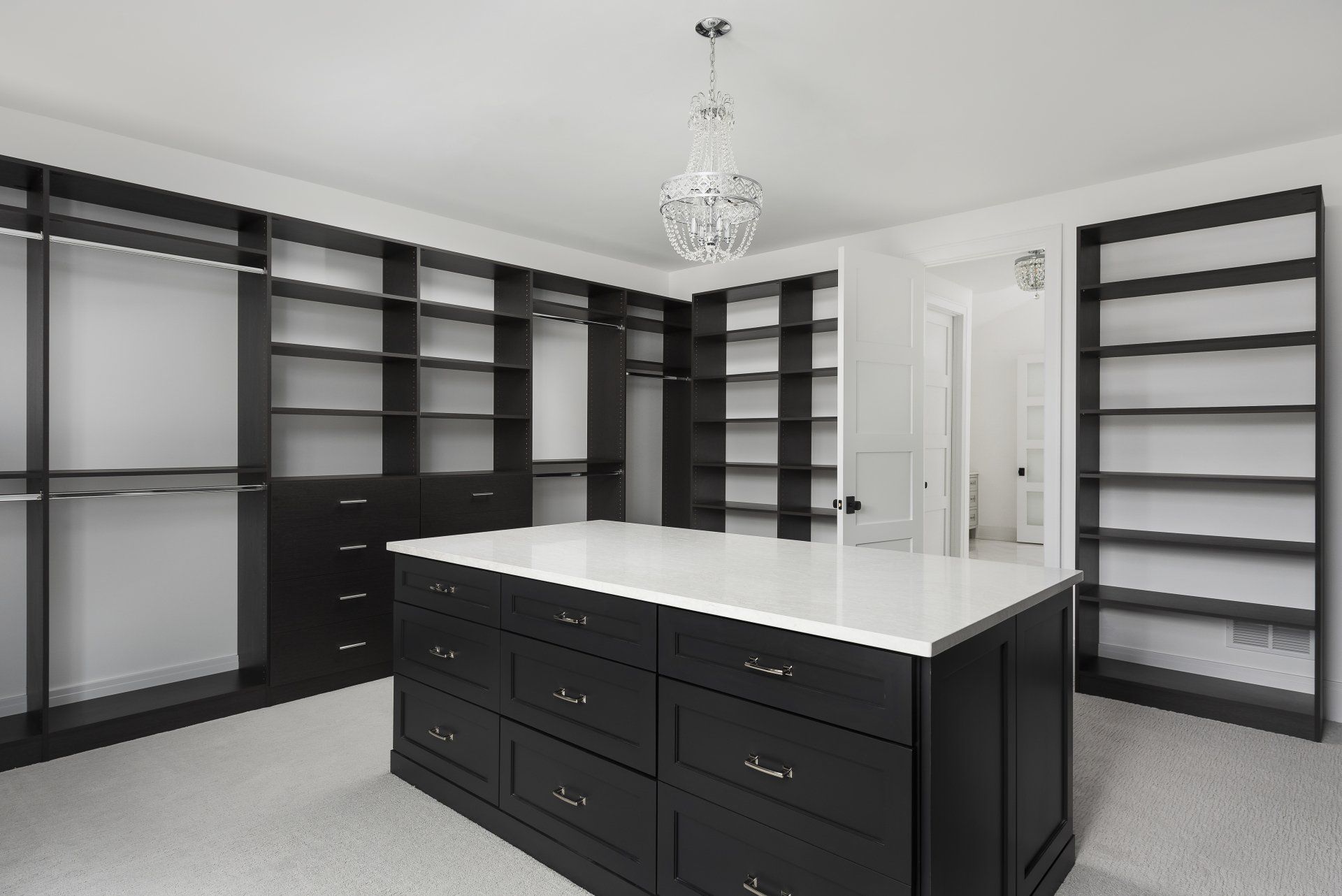 There is a large island in the middle of the walk in closet.