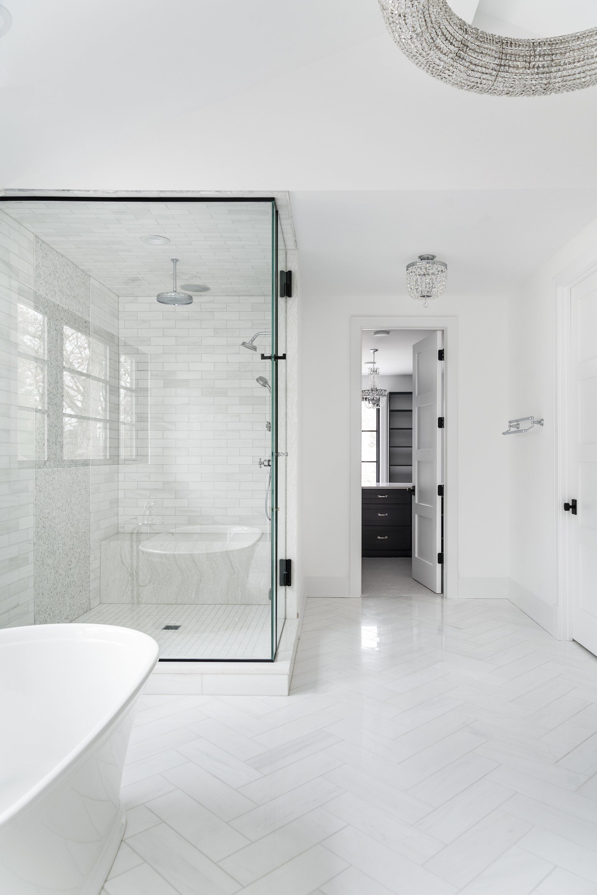 A bathroom with a bathtub and a walk in shower.