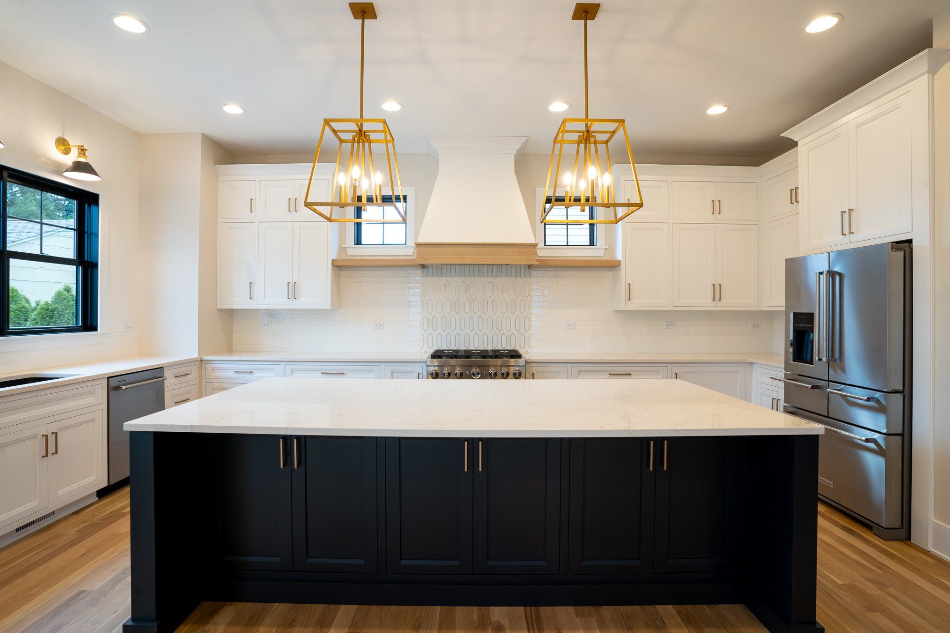 There is a large island in the middle of the kitchen.