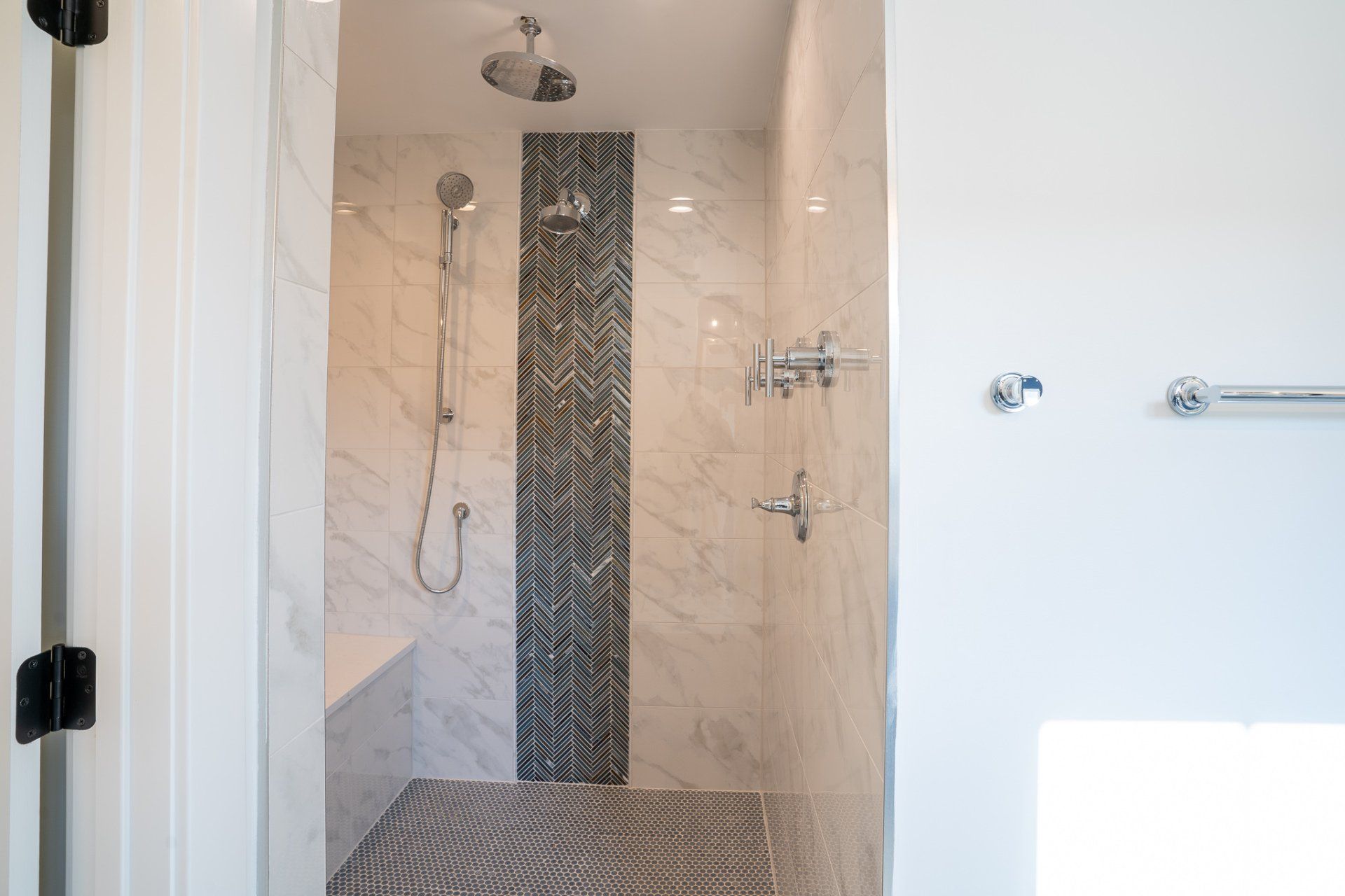 A bathroom with a walk in shower and a bathtub.