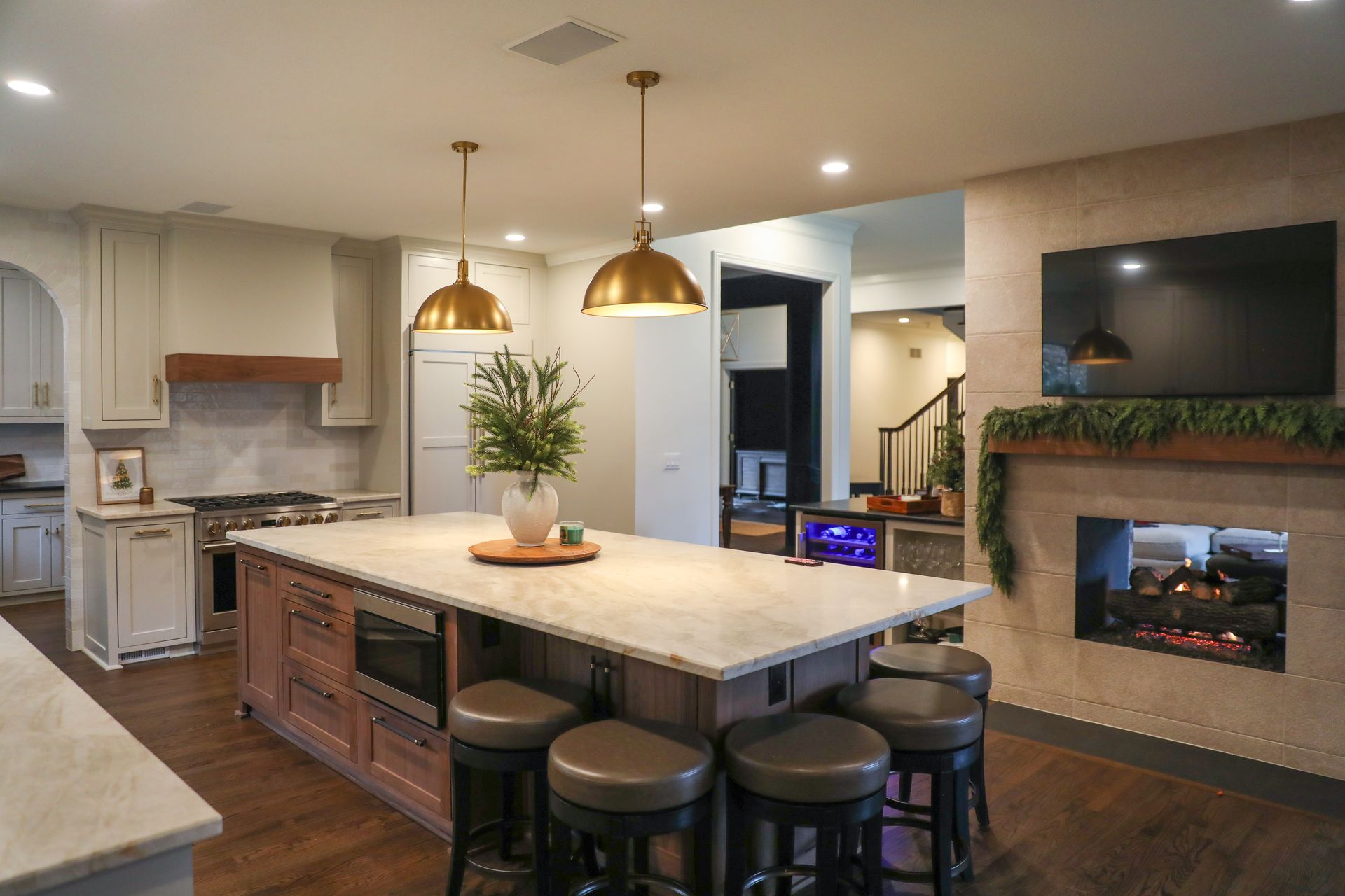 Interior during renovation, unfinished walls, staircase, construction debris, bright.