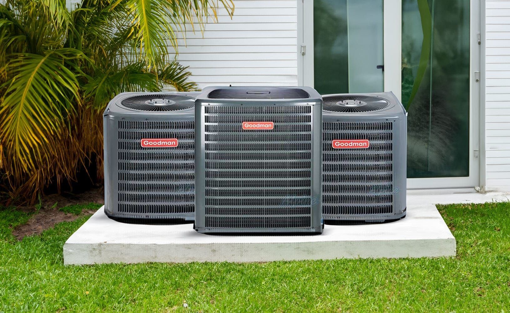 Two outdoor HVAC units sitting on a concrete pad near foliage, with gauges attached to the left unit for servicing.