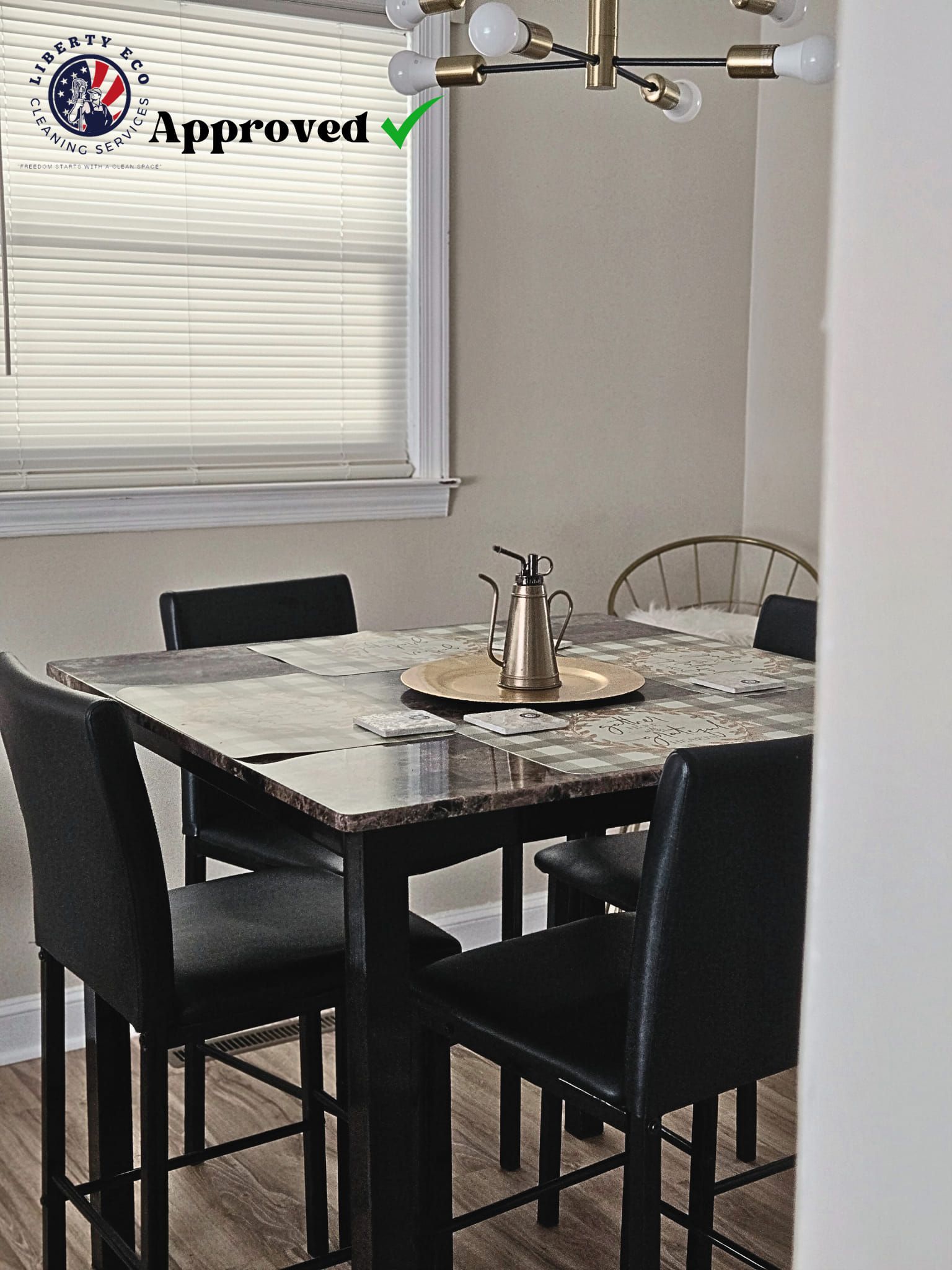 Dining room with a table, chairs, and a window.