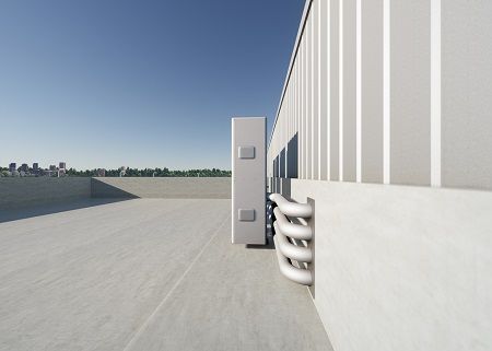 A large white building with a lot of pipes coming out of it.