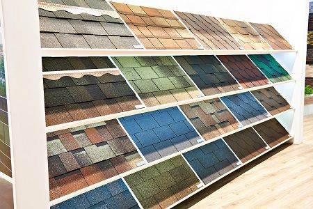 There are many different types of shingles on display in a store.