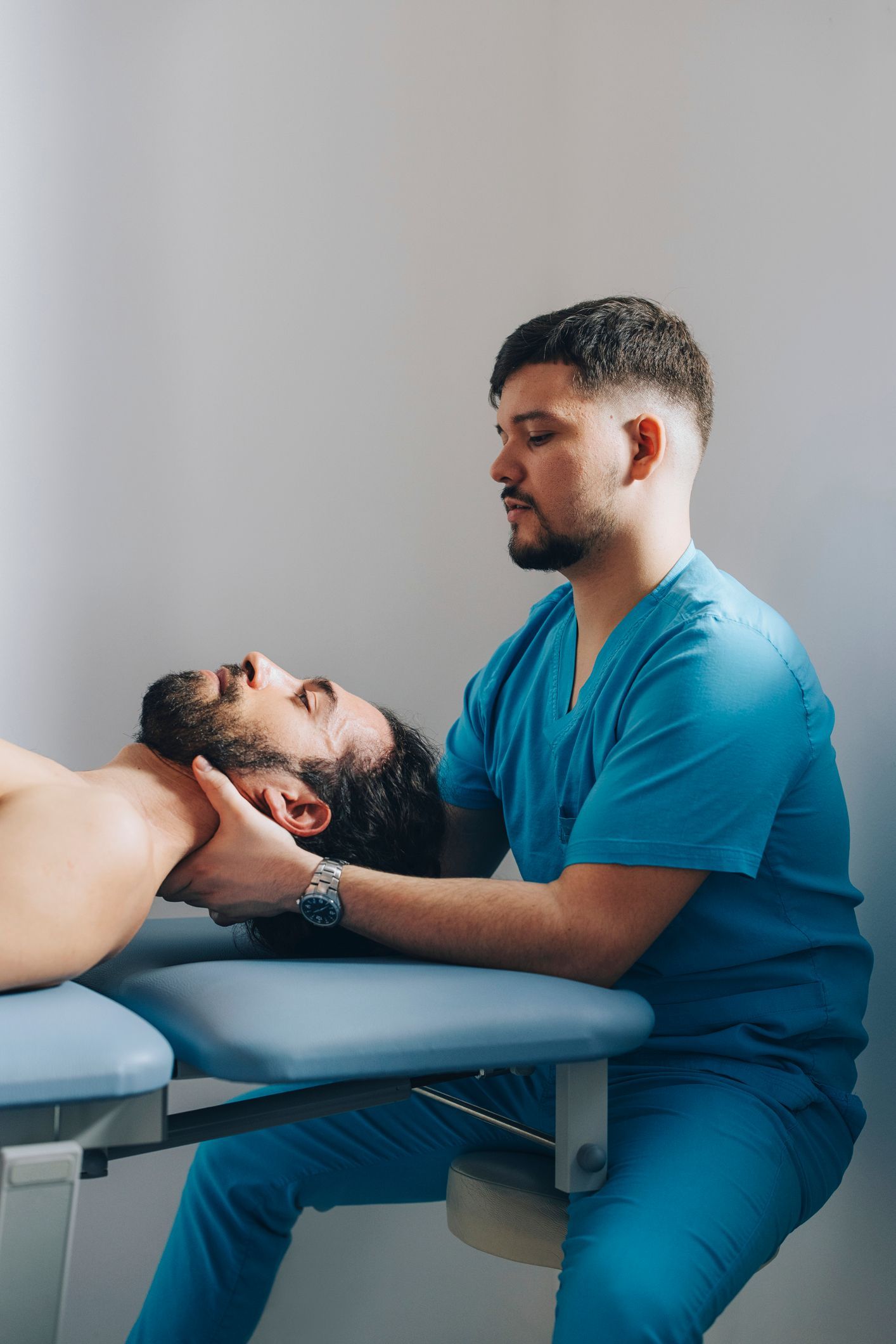 A man is laying on a table getting a therapy - Mountain Home, AR - Long Chiropractic
