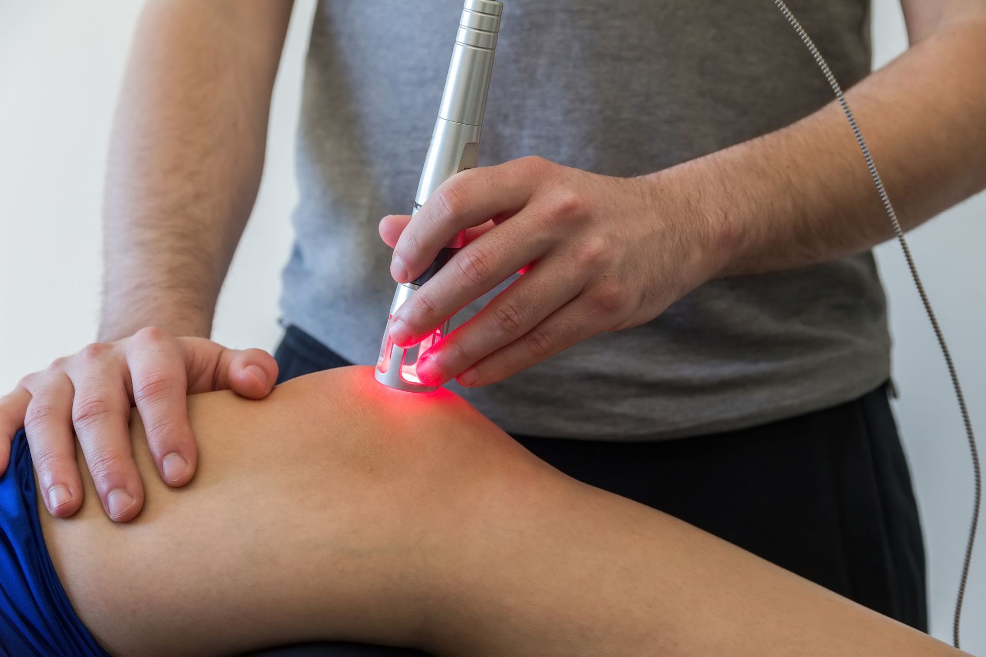A person is getting a laser treatment on their knee - Mountain Home, AR - Long Chiropractic
