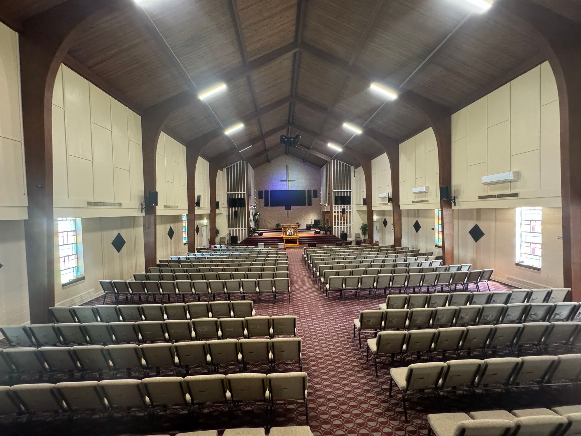 The large auditorium of the convention center with 400 comfortable chairs is spacious and brightly lit with stained glass windows. It is a perfect wedding venue. 