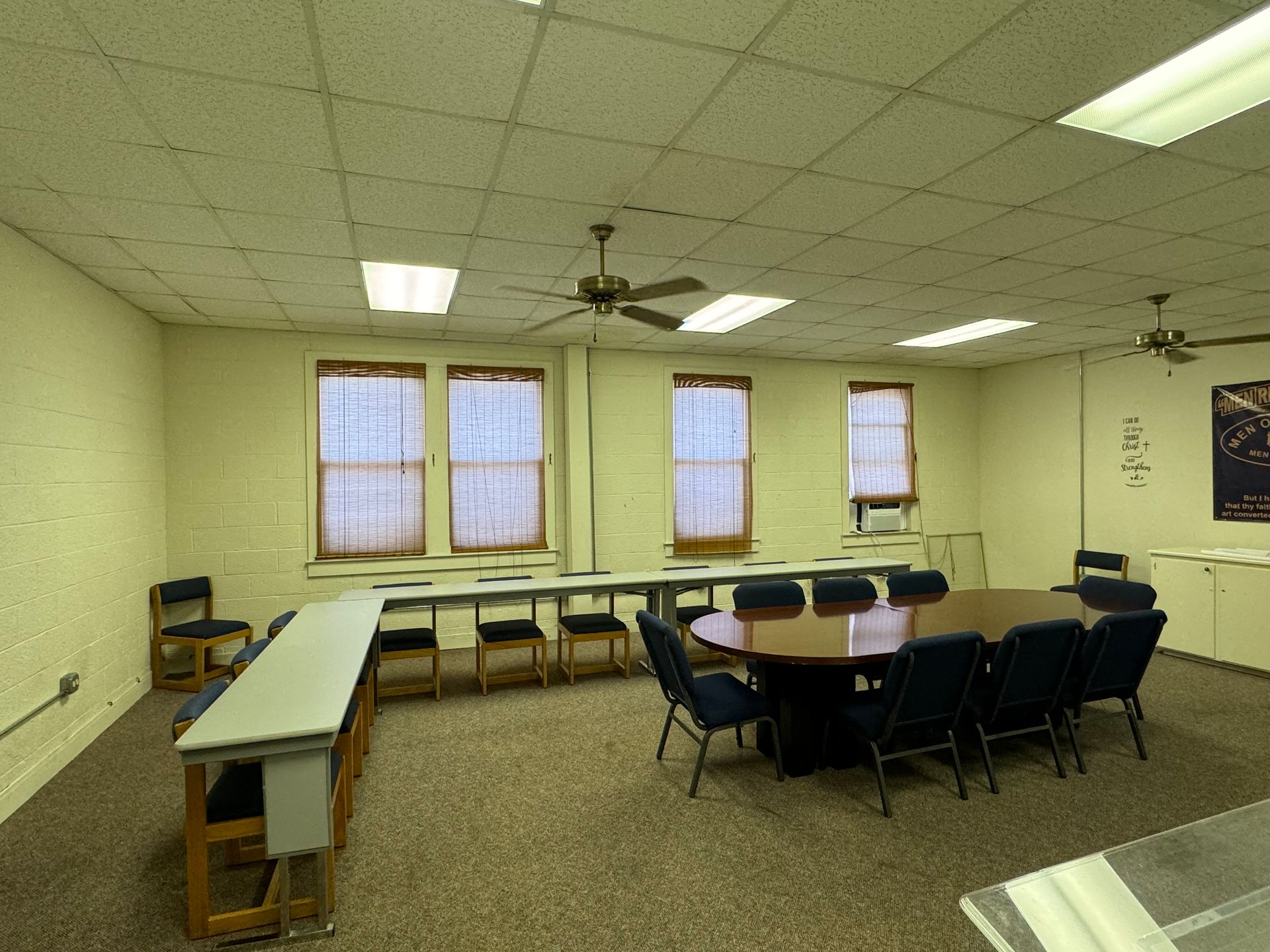 Convention center meeting space, classroom with desks and chairs arranged for a seminar.