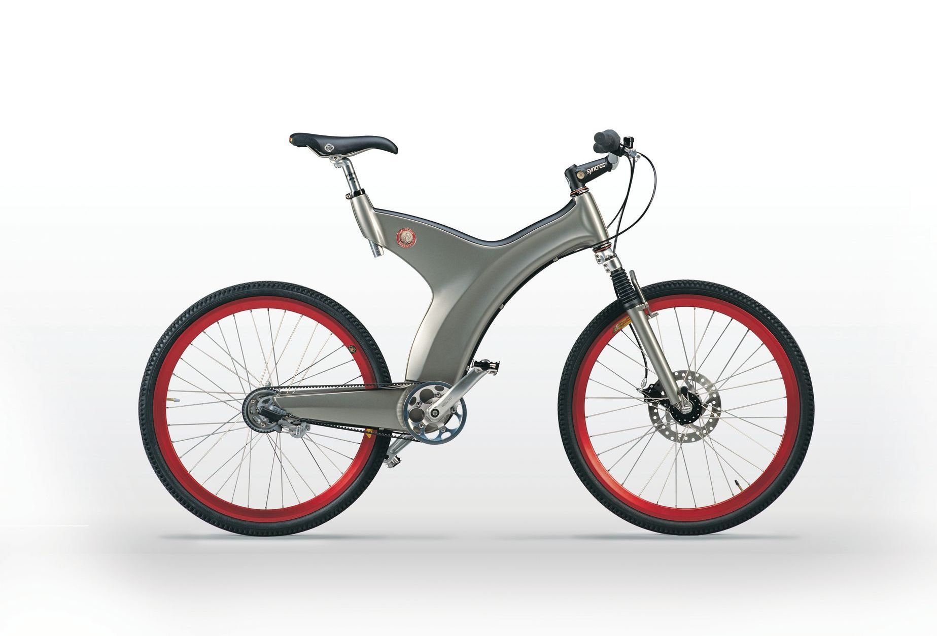 Gray and red mountain bike with unique frame design against a white background.