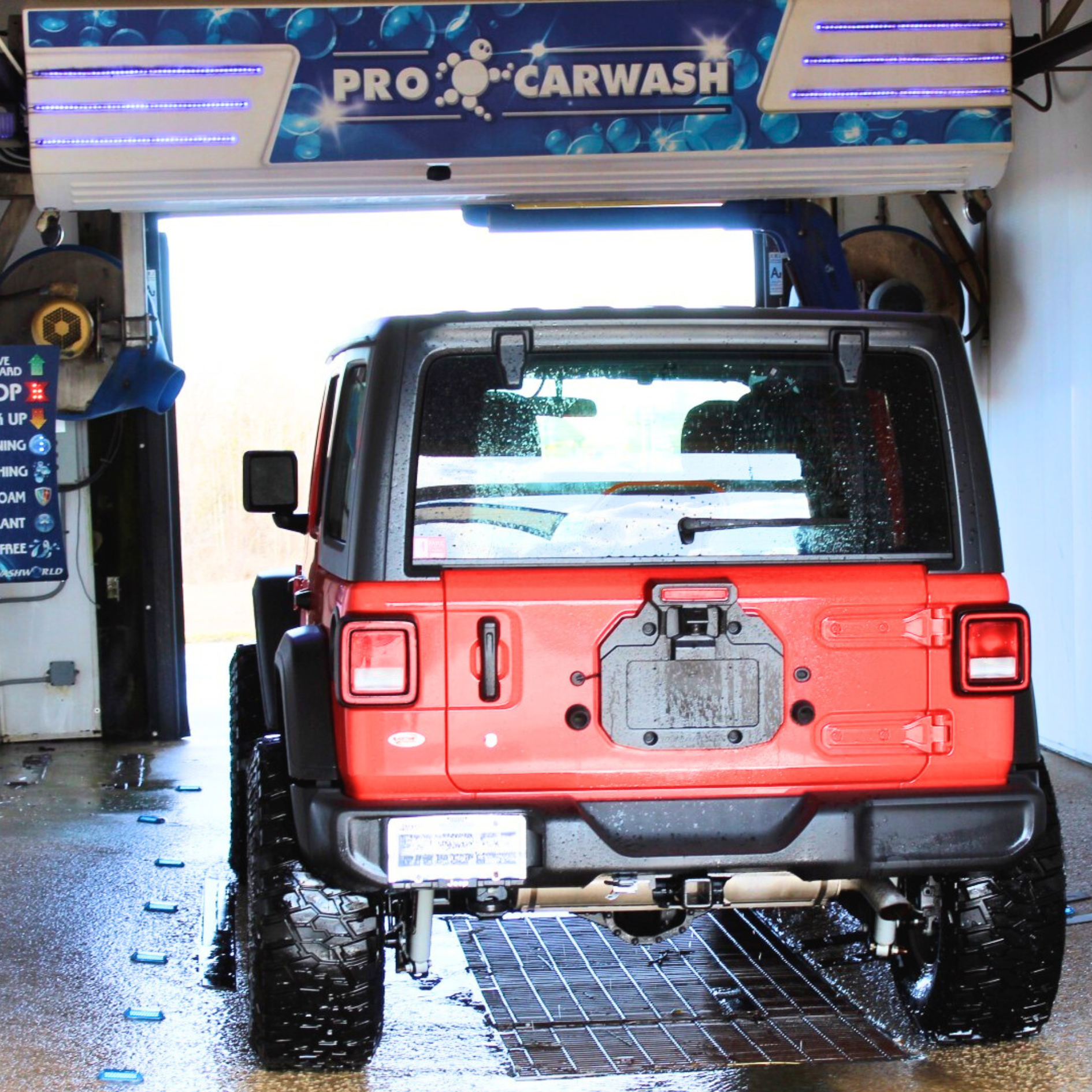 Red Jeep Wrangler entering a