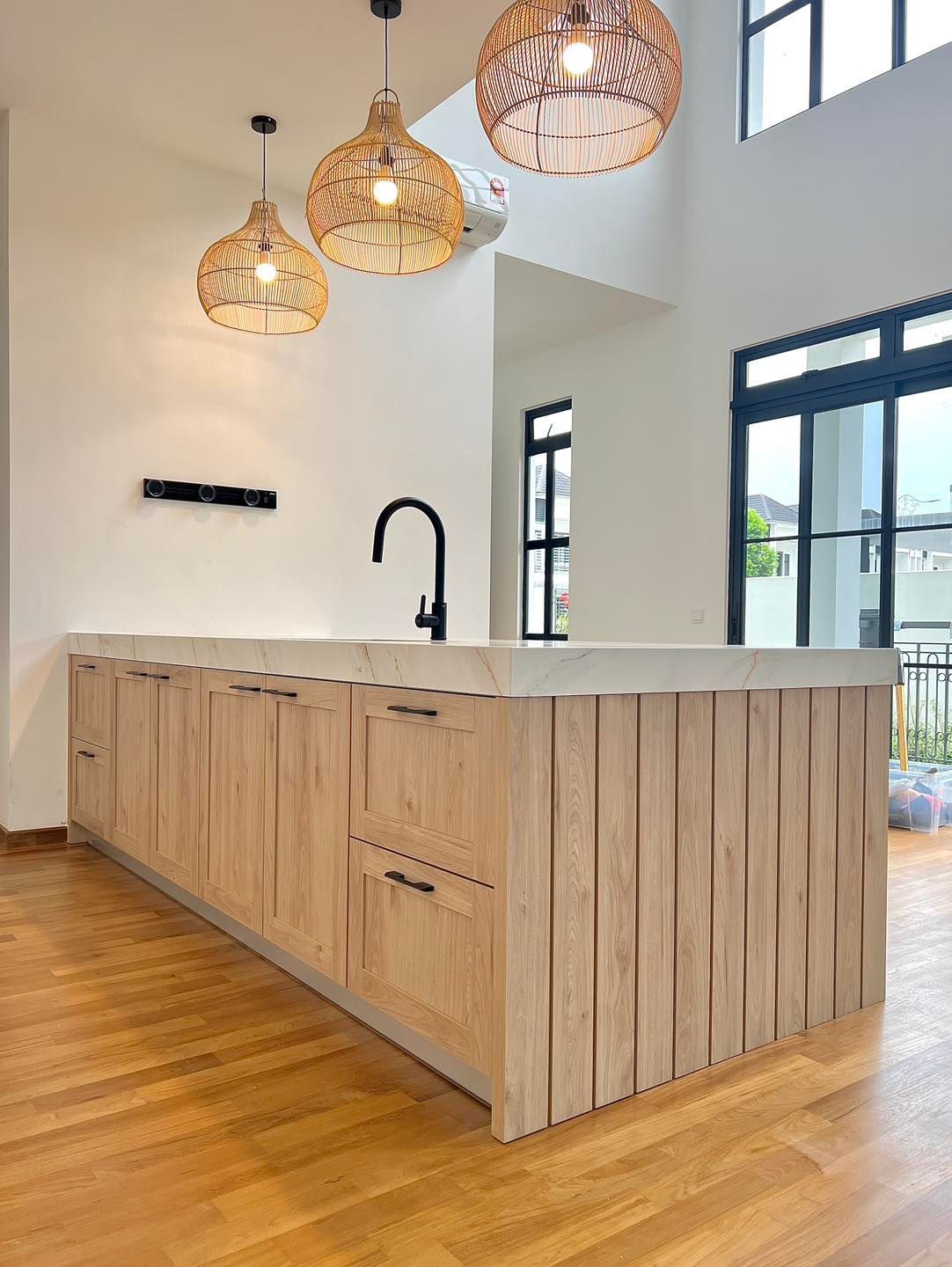 A kitchen with wooden cabinets and a sink.