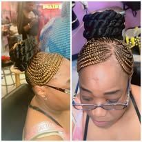 Two women with braided hairstyles, one blonde and one black, smiling.