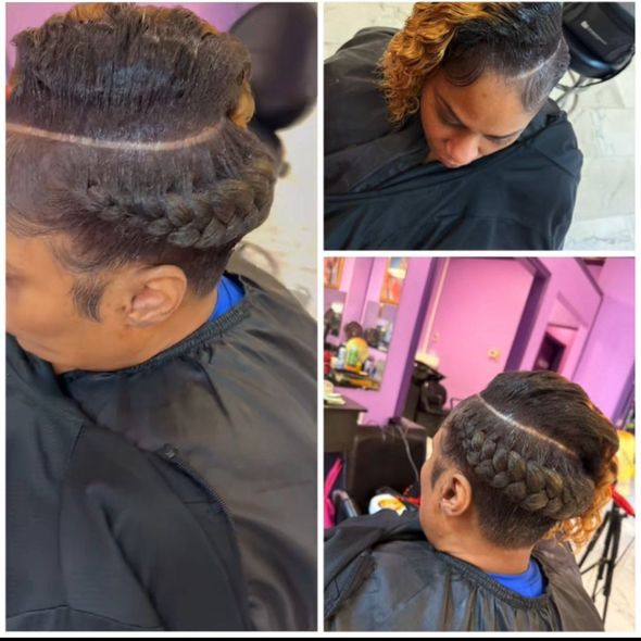 Hands clipping sections of wavy, ombre-colored hair.