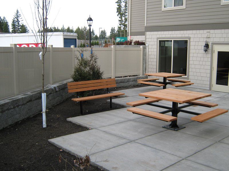 White Fence with Brown Tables — Auburn, WA — Rainier Fencing & Decking