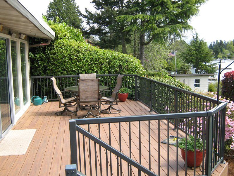 Gray Railing with Table and Chair — Auburn, WA — Rainier Fencing & Decking
