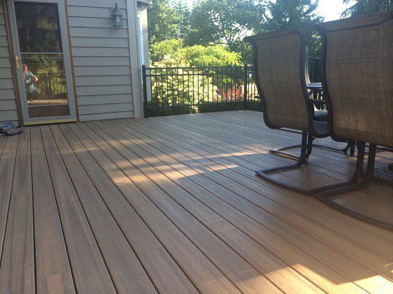 Wooden Floor with Table and Chairs — Auburn, WA — Rainier Fencing & Decking