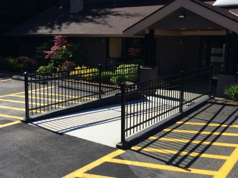 Black Fence in Parking — Auburn, WA — Rainier Fencing & Decking