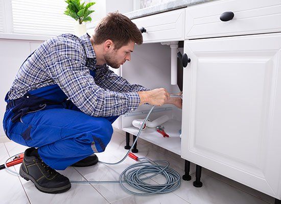 Plumber Cleaning Clogged Sink  — Hatfield, MA — AM/PM Plumbing & Heating