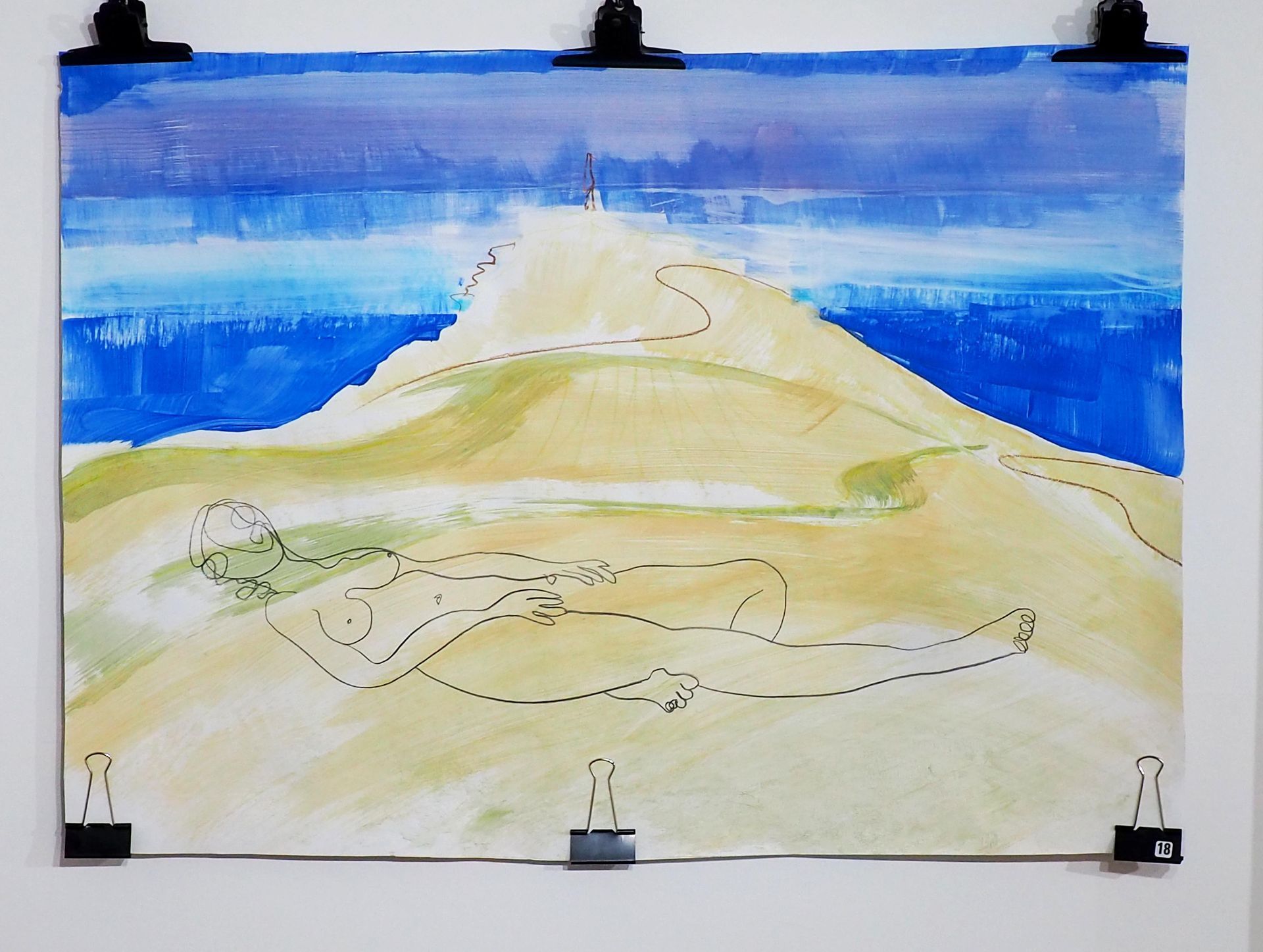 A  hill (Cape Cornwall) formed with large yellowy / green brush strokes. Blue sea and sky in the back ground. Foreground has a simple black line drawing of a reclined naked figure. 