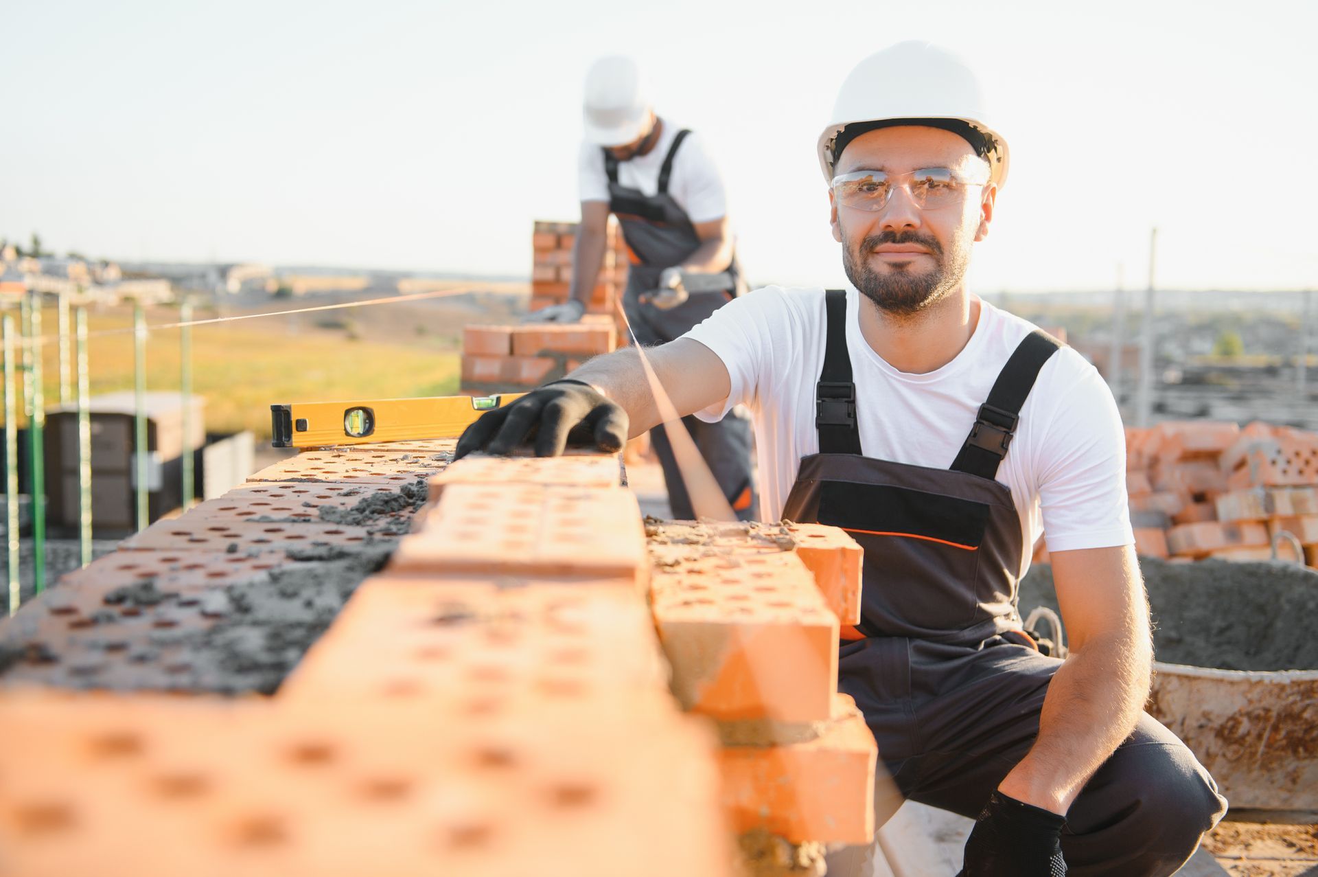 construction-worker-man-work-clothes-construction-helmet-portrait-positive-male-builder-hardhat-working-construction-site