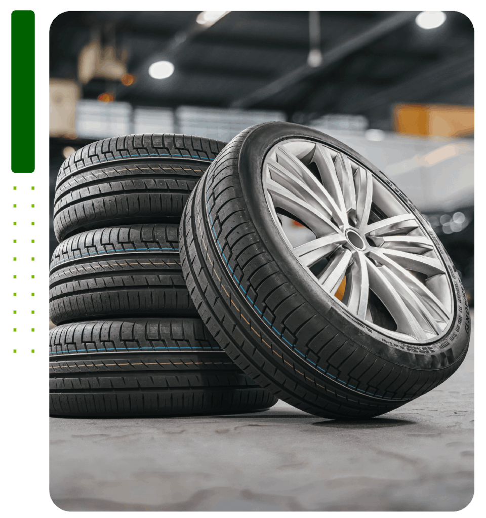 A stack of tires sitting on top of each other in a garage.