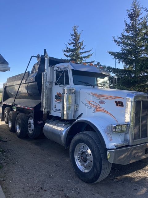 A dump truck with the number 18 on it