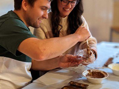 Couple taking part in chocolate making class
