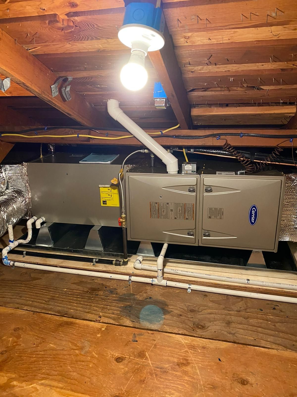 A picture of an air conditioner in a basement.