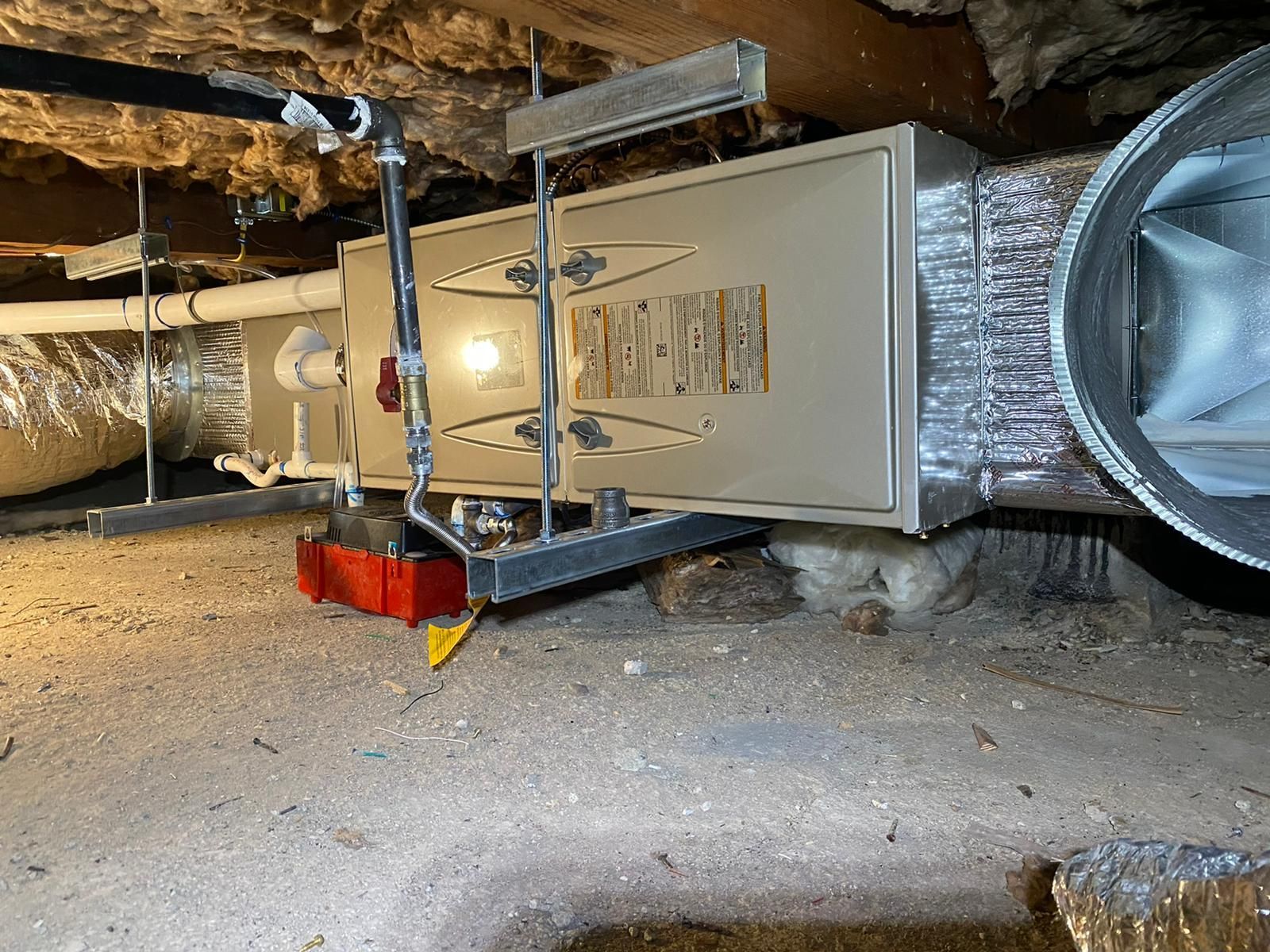 A ventilation system is installed in a basement.